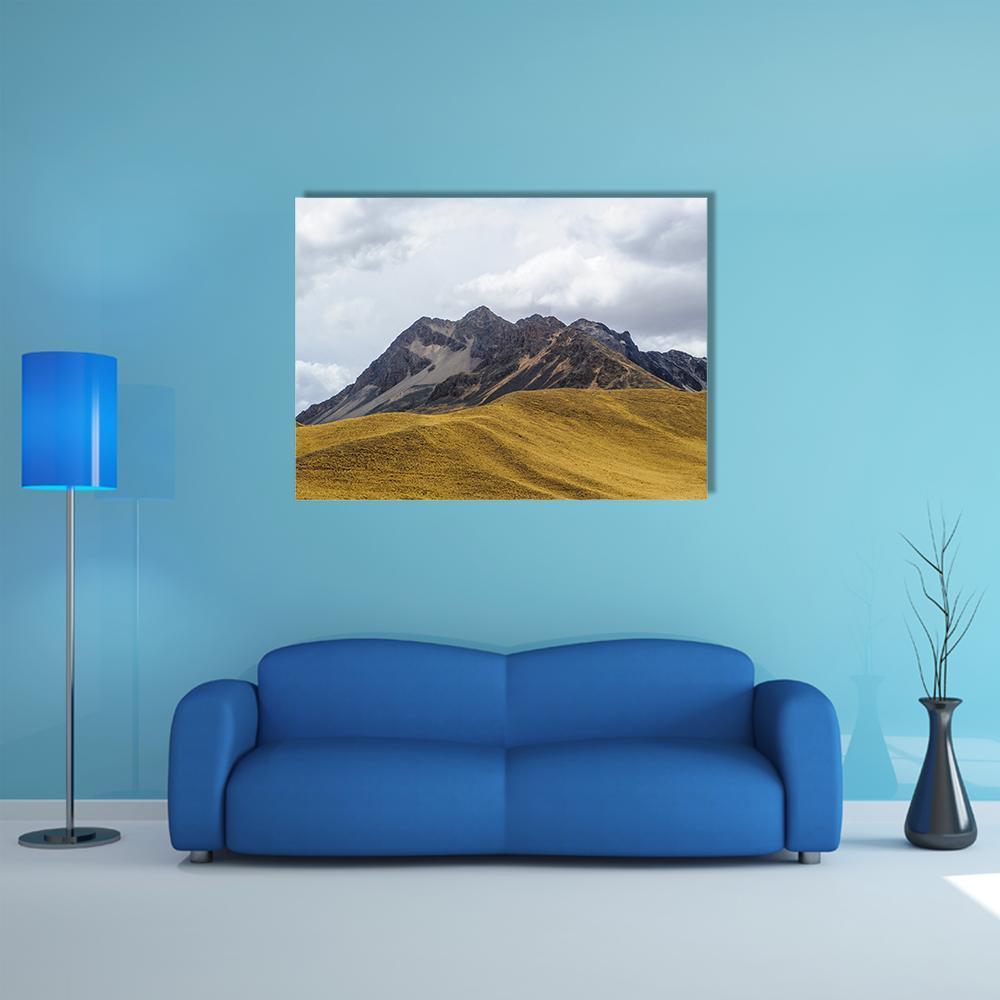 Rocky Peaks and Grassy Hills Canvas Wall Art in gray, brown and yellow, single panel hung on a wall