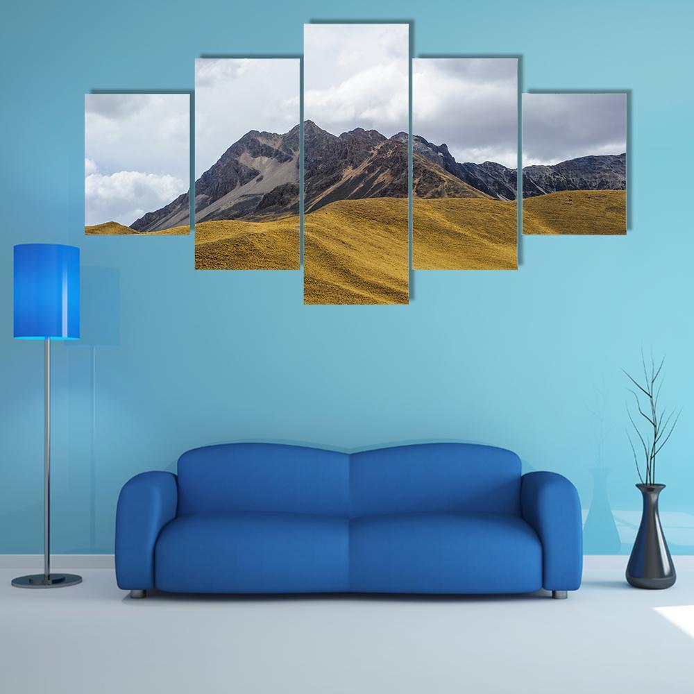 Rocky Peaks and Grassy Hills Canvas Wall Art in gray, brown and yellow, 5 panel Star layout hung on a wall