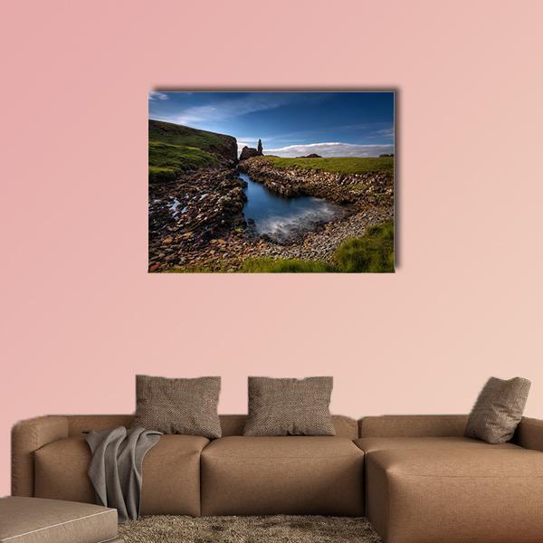 Rocky Coastline in Scotland Canvas Wall Art in brown, green and blue, single panel hung on a wall