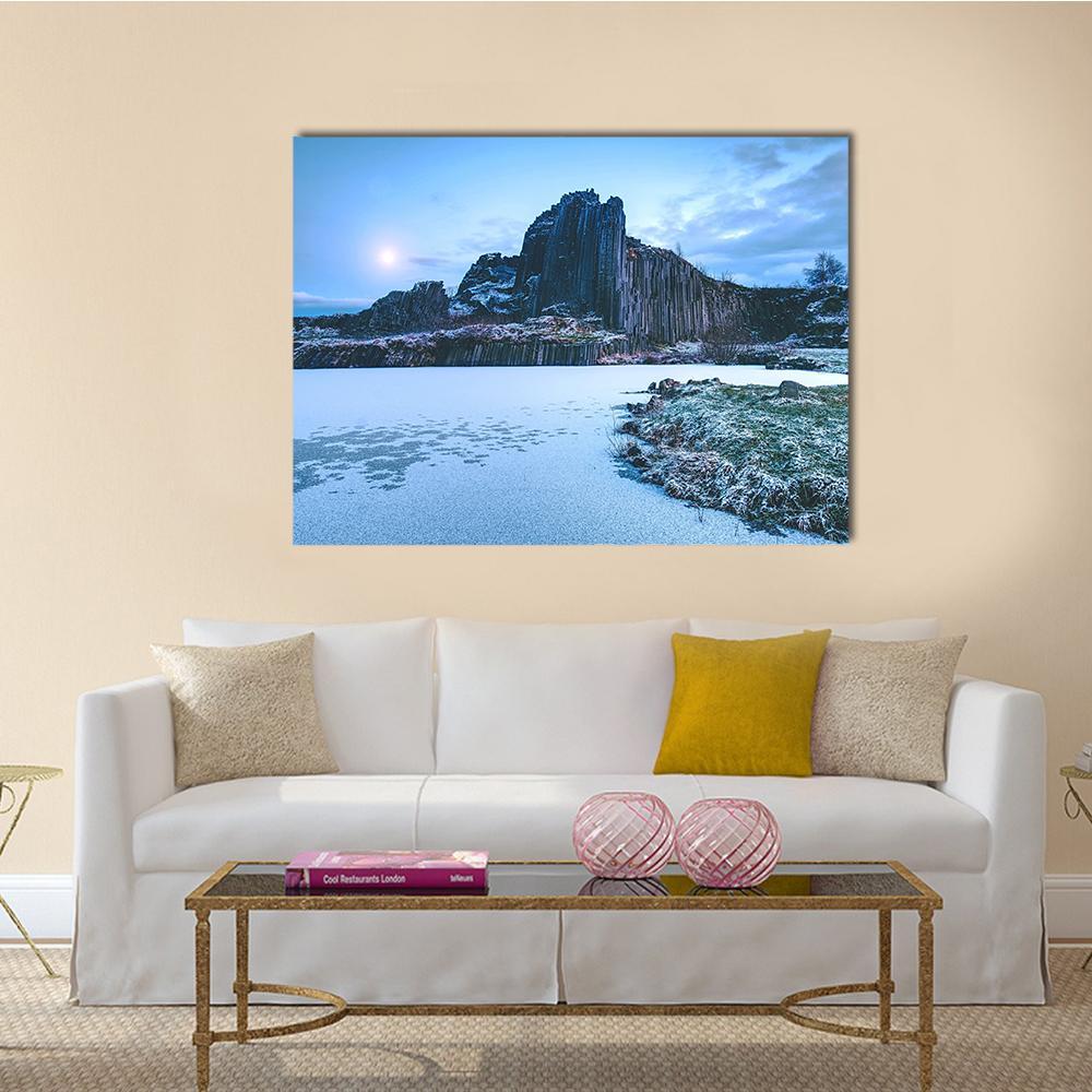 Snow-covered Rocky Hill in Winter Canvas Wall Art in white, gray and blue, single panel hung on a wall