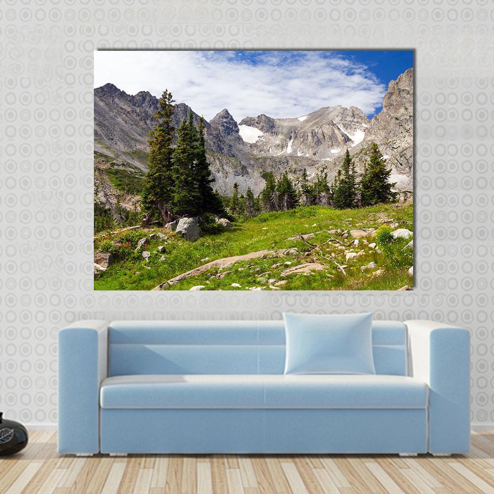 Rocky Mountains Landscape Canvas Wall Art in gray, green and blue, single panel hung on a wall