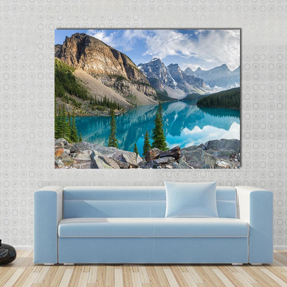Rocky Mountains and Moraine Lake Canvas Wall Art in gray, brown and blue, single panel hung on a wall