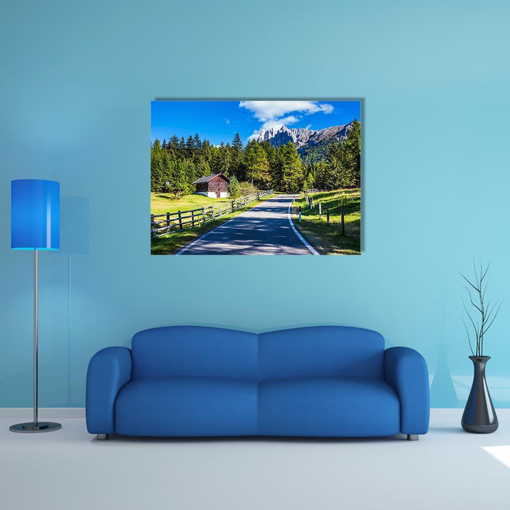 Winding Road to Snow-capped Peaks Canvas Wall Art in gray, green and blue, single panel hung on a wall