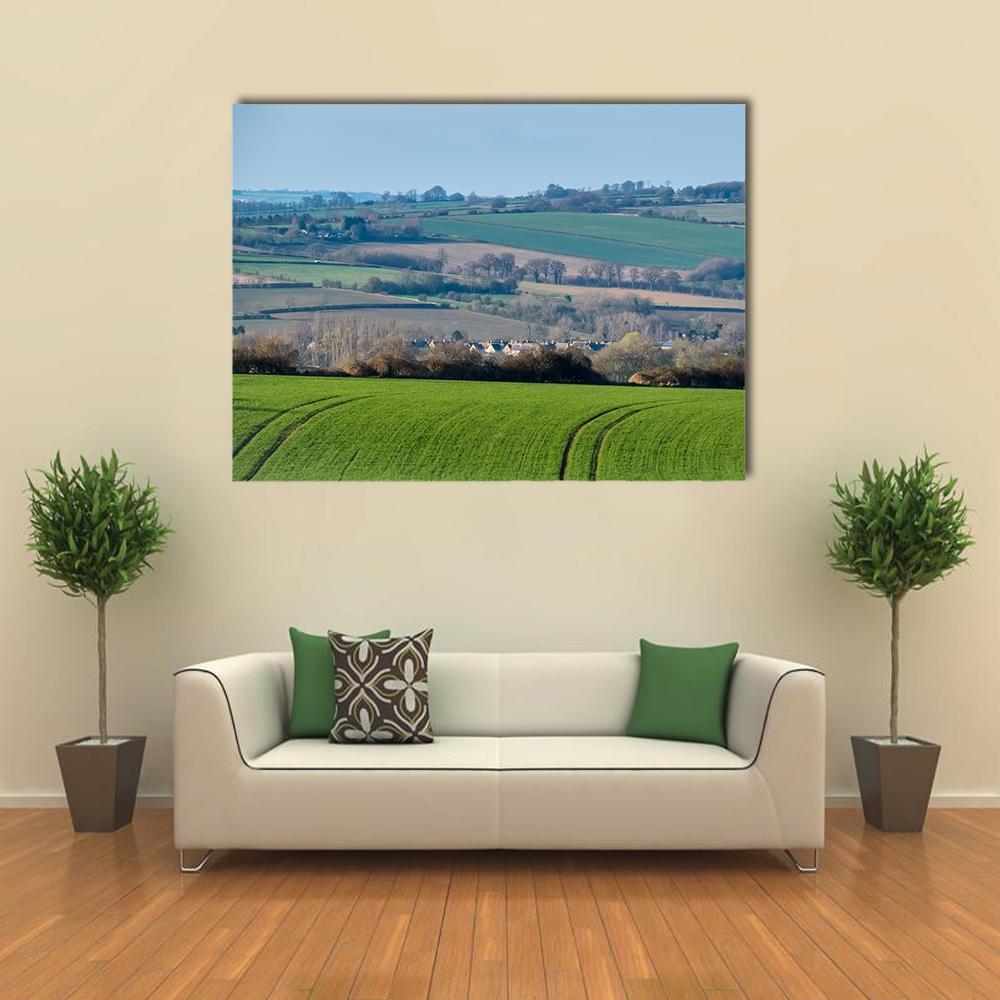 Rolling Oxfordshire Countryside Canvas Wall Art in brown, green and blue, single panel hung on a wall