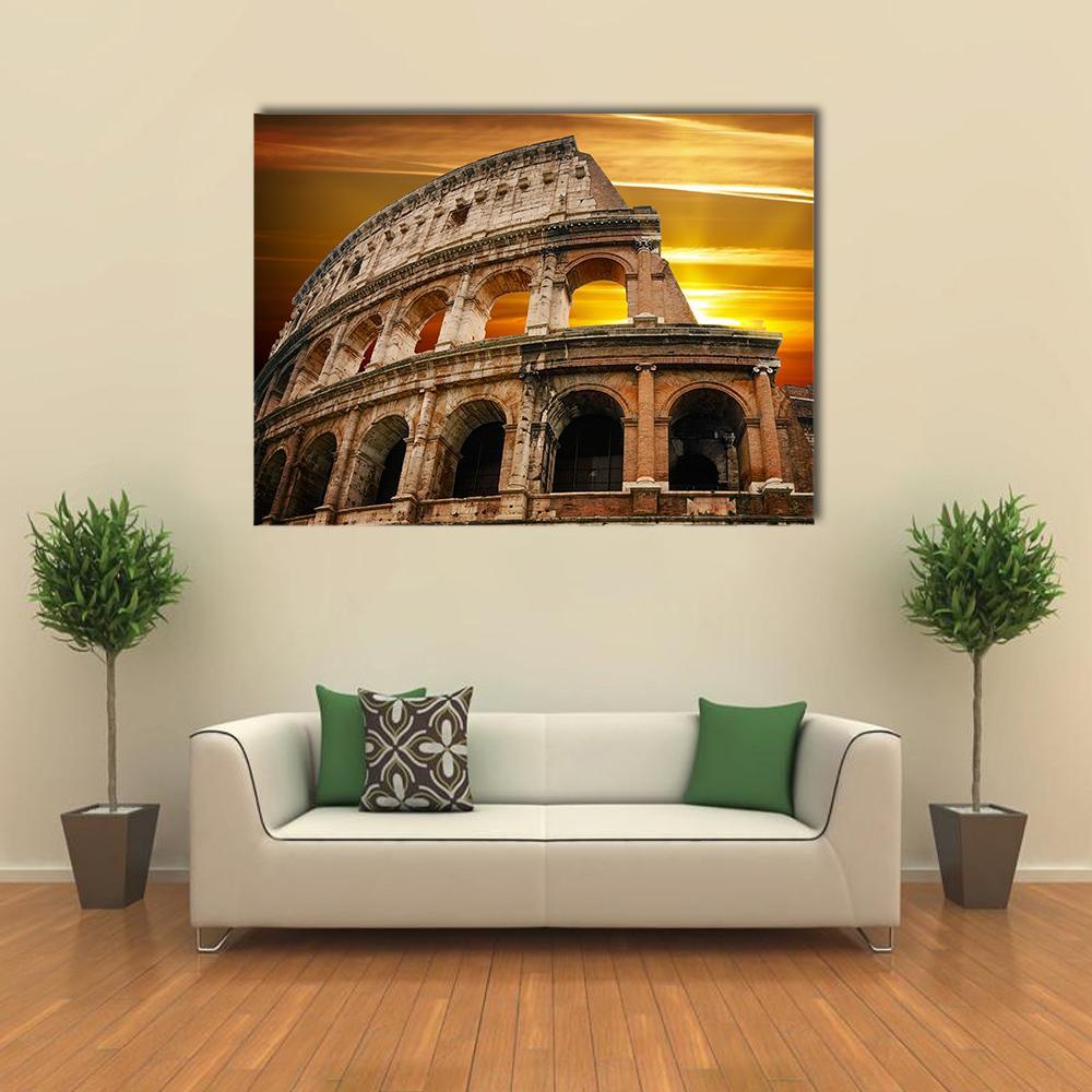 Roman Colosseum at Sunrise Canvas Wall Art in brown, gold and orange, single panel hung on a wall