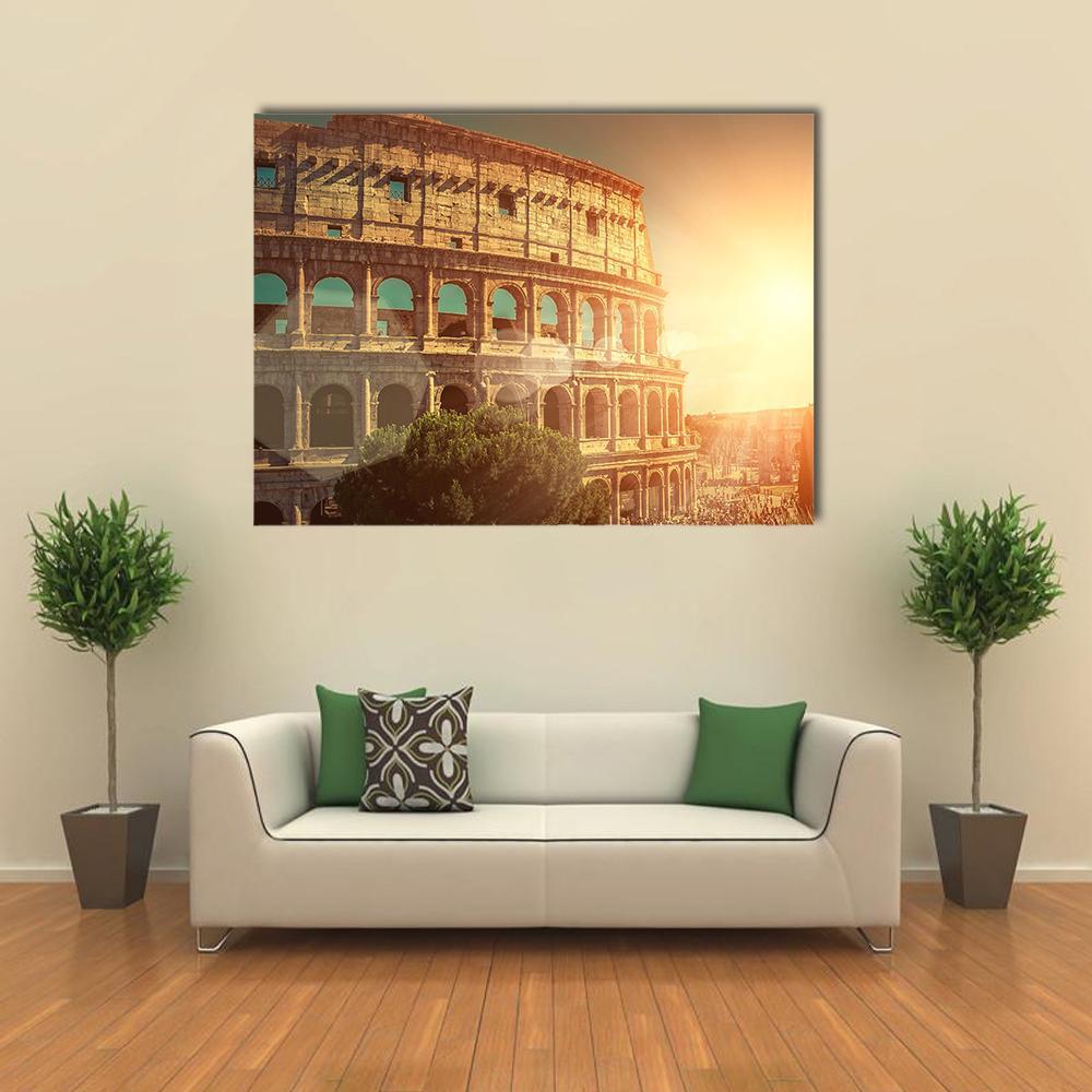 Colosseum in Warm Sunset Canvas Wall Art in brown, orange and yellow, single panel hung on a wall