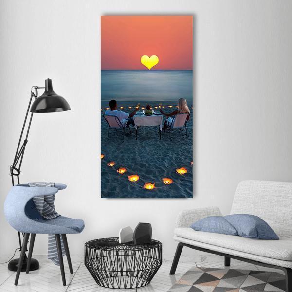 Romantic Beach Dinner at Sunset Vertical Canvas Wall Art in orange, yellow and blue, single vertical panel hung on a wall