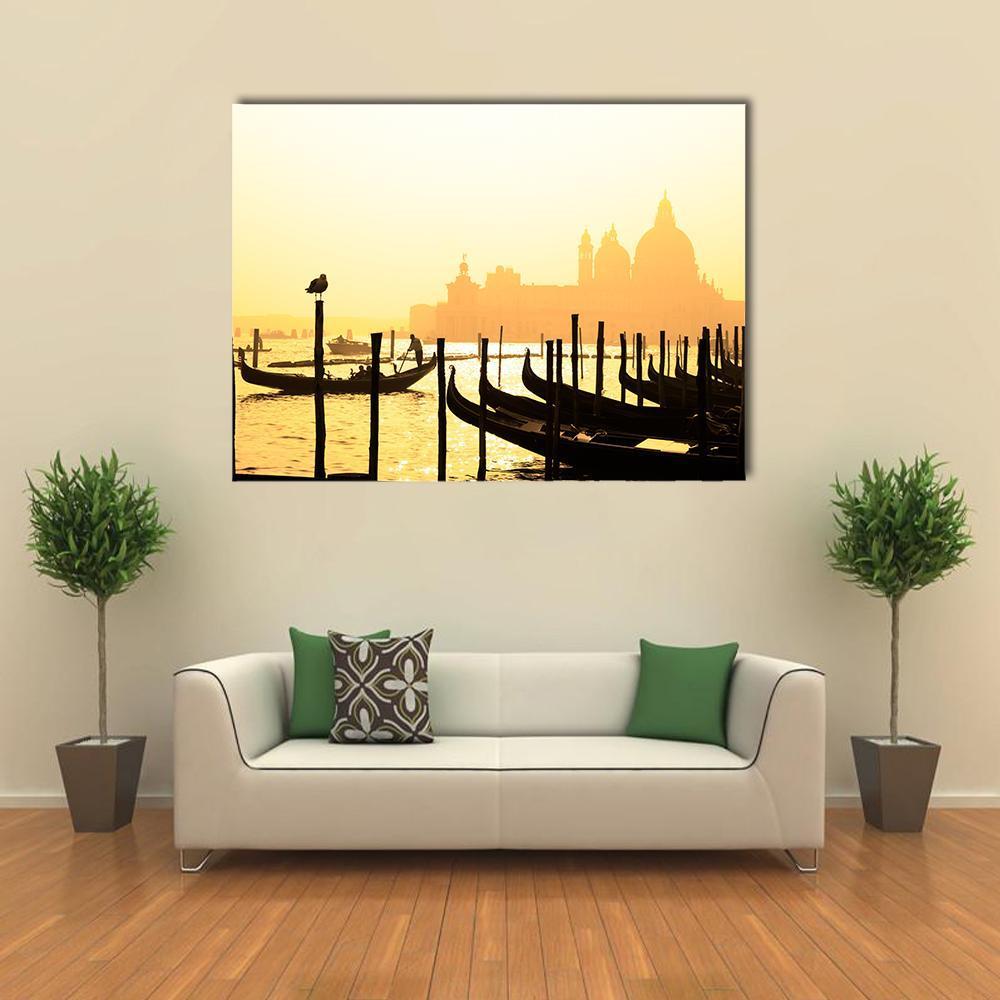 Sunset Gondolas on Venetian Canals Canvas Wall Art in black, orange and yellow, single panel hung on a wall