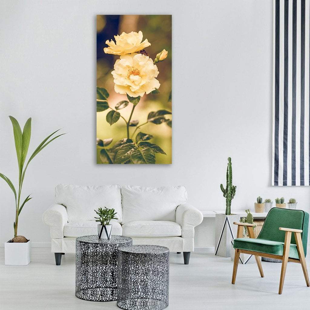 Summer Yellow Rose Close-up Vertical Canvas Wall Art in yellow and green, single vertical panel hung on a wall
