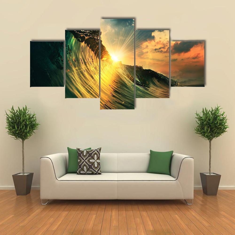 Sunburst Ocean Wave at Sunset Canvas Wall Art in orange, yellow and blue, 5 panel Star layout hung on a wall
