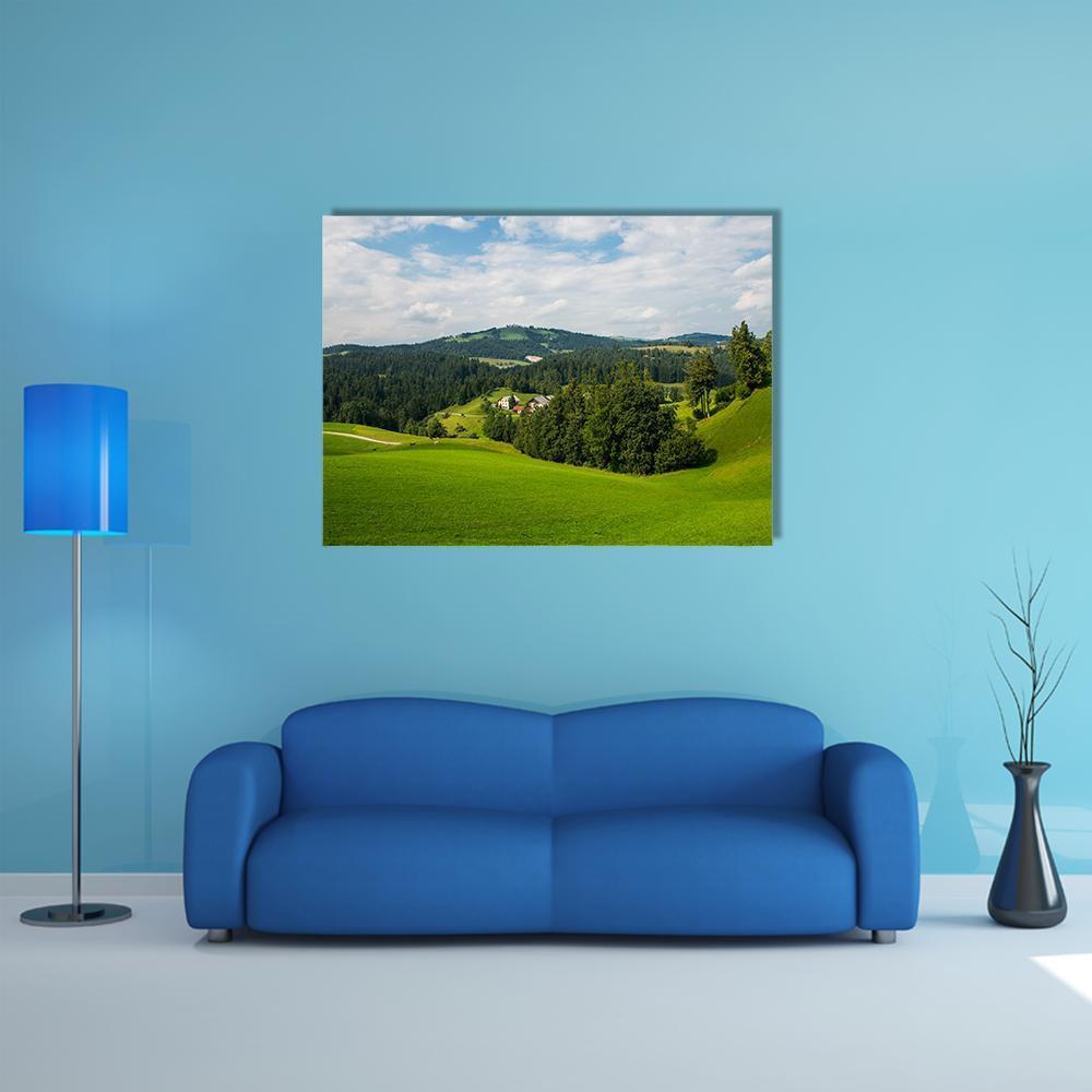 Rovte Village in Slovenia Canvas Wall Art in white, green and blue, single panel hung on a wall