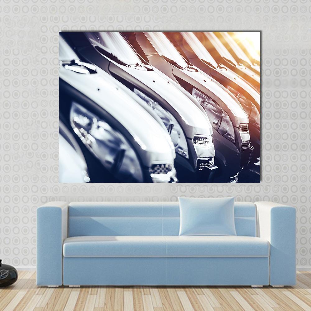 Row of Brand New Cars for Sale Canvas Wall Art in black, white and gray, single panel hung on a wall