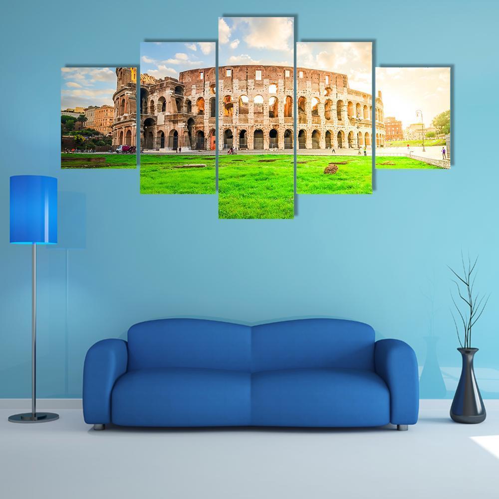 Colosseum Ruins in Rome Canvas Wall Art in beige, green and blue, 5 panel Star layout hung on a wall