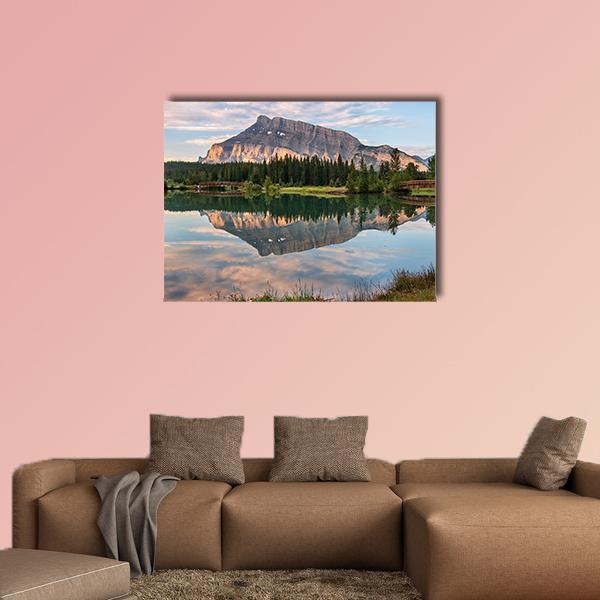 Rundle Mountain Reflected in Pond Canvas Wall Art in brown, green and blue, single panel hung on a wall
