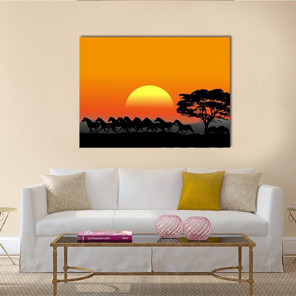 Running Herd at Sunset Canvas Wall Art in black, orange and yellow, single panel hung on a wall