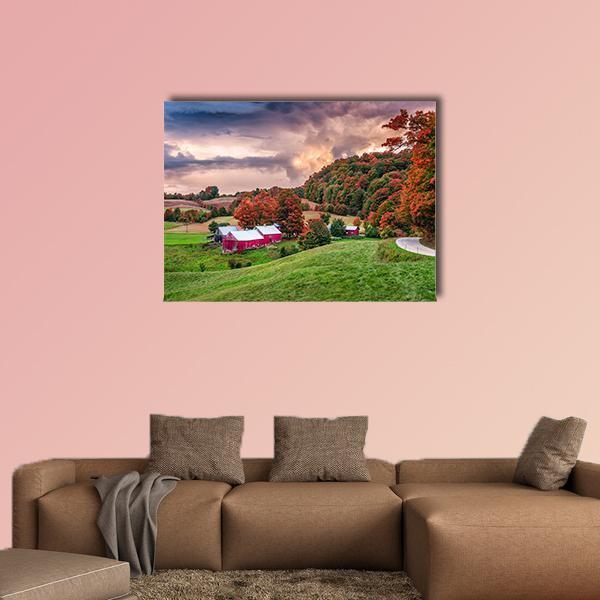 Autumn Farmhouse with Two Red Barns Canvas Wall Art in red, orange and green, single panel hung on a wall