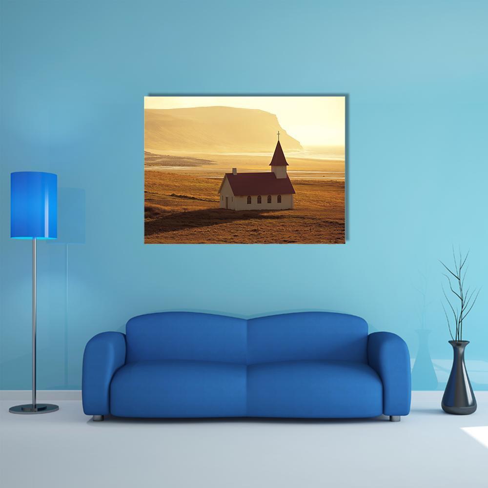 Icelandic Church at Golden Hour Canvas Wall Art in brown, gold and yellow, single panel hung on a wall
