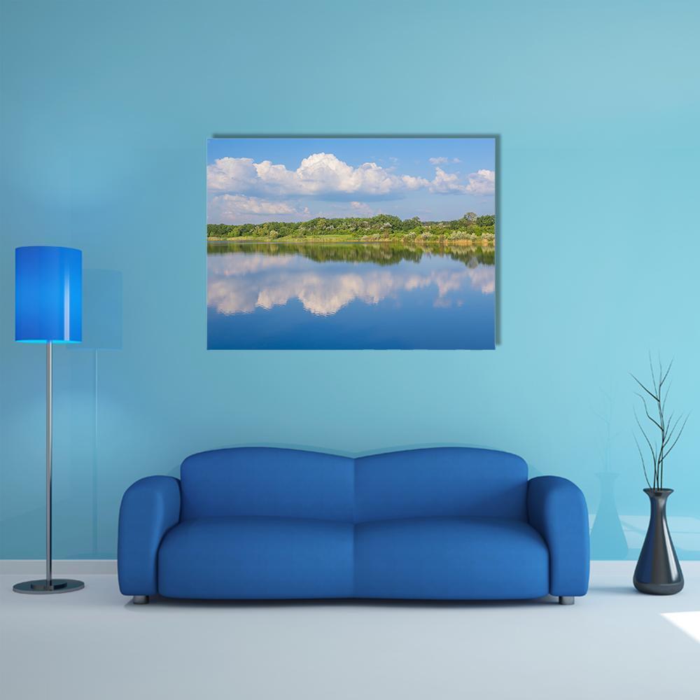 Rural Lake Landscape Canvas Wall Art in white, green and blue, single panel hung on a wall