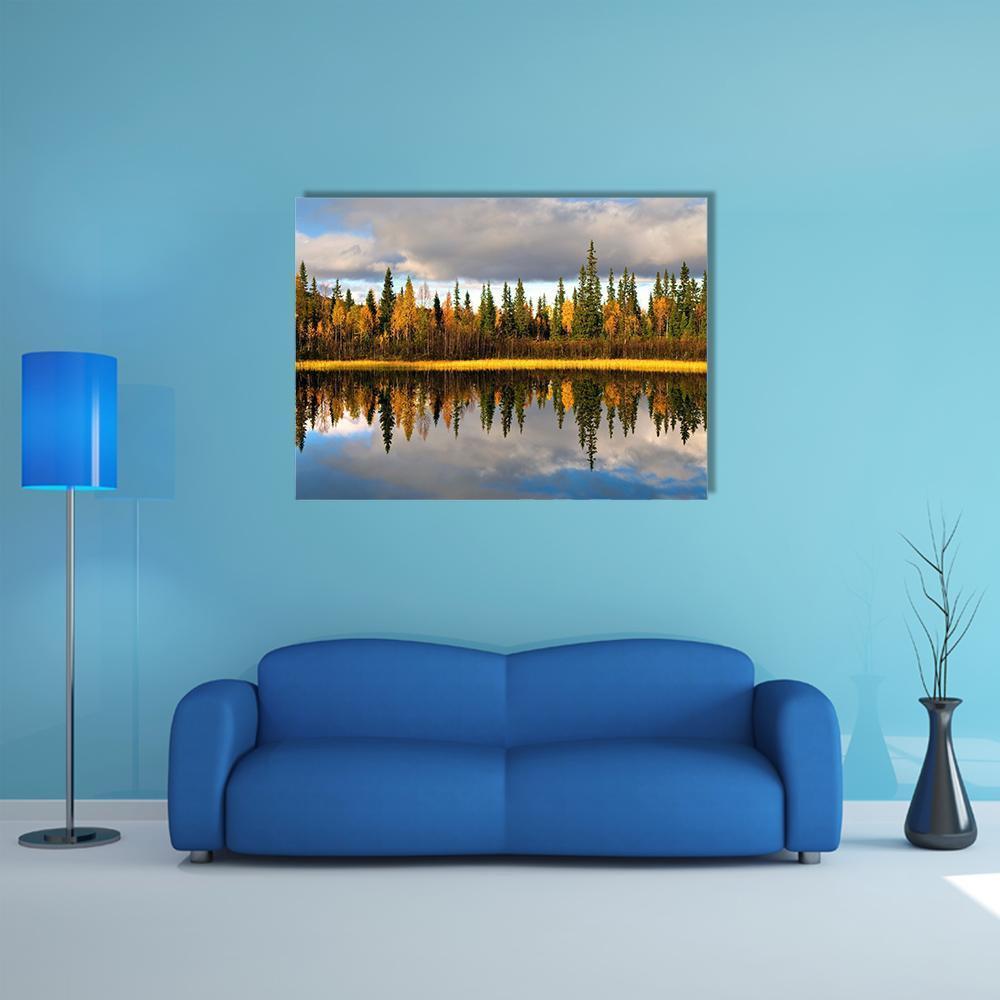 Rural Scandinavian Landscape Canvas Wall Art in yellow, green and blue, single panel hung on a wall