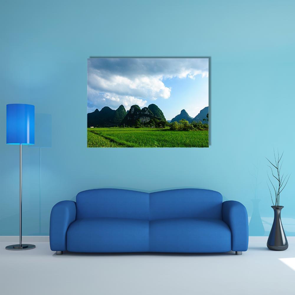Summer Karst Mountains and Rice Fields Canvas Wall Art in white, green and blue, single panel hung on a wall