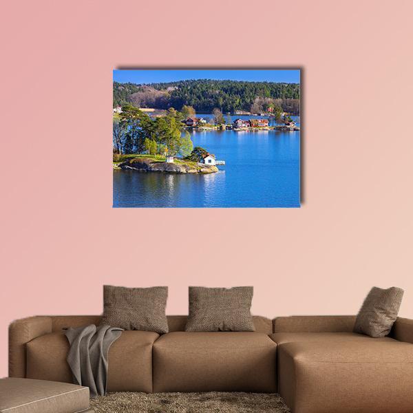 Rural Swedish Coastal Village Landscape Canvas Wall Art in green and blue, single panel hung on a wall