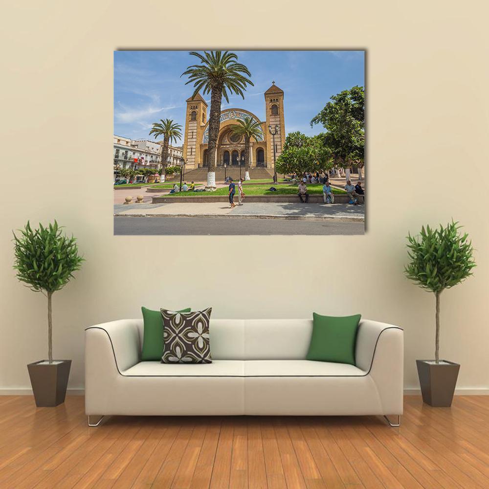 Sacred Heart Cathedral Canvas Wall Art in beige, green and blue, single panel hung on a wall