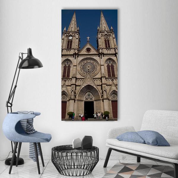Sacred Heart Cathedral in China Vertical Canvas Wall Art in gray, beige and blue, single vertical panel hung on a wall