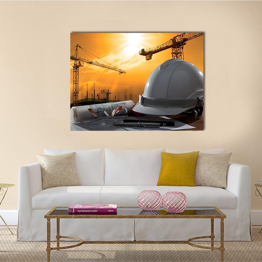 White Hard Hat with Blueprints Canvas Wall Art in white, orange and yellow, single panel hung on a wall