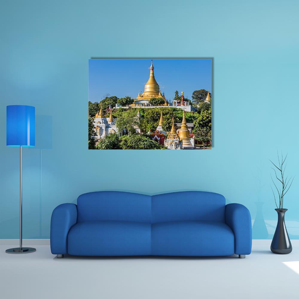 Temples on Sagaing Hills Near Mandalay Canvas Wall Art in gold, green and blue, single panel hung on a wall