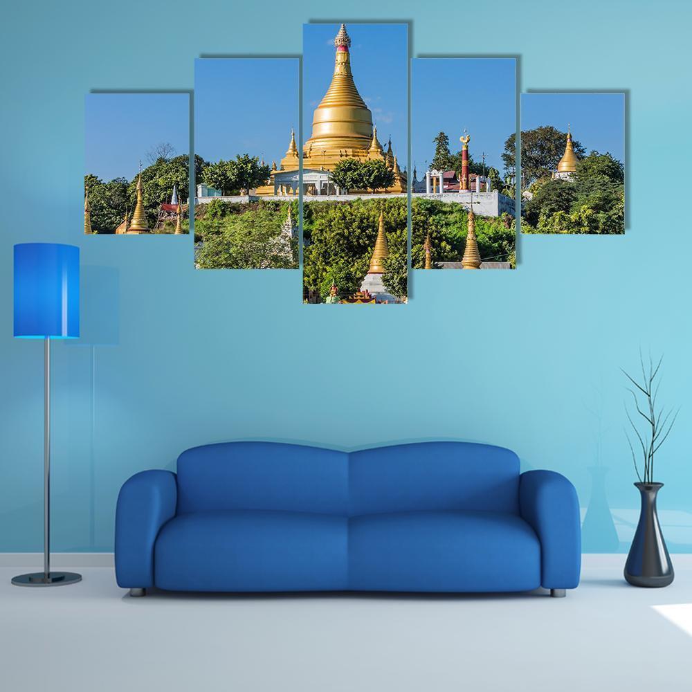 Temples on Sagaing Hills Near Mandalay Canvas Wall Art in gold, green and blue, 5 panel Star layout hung on a wall