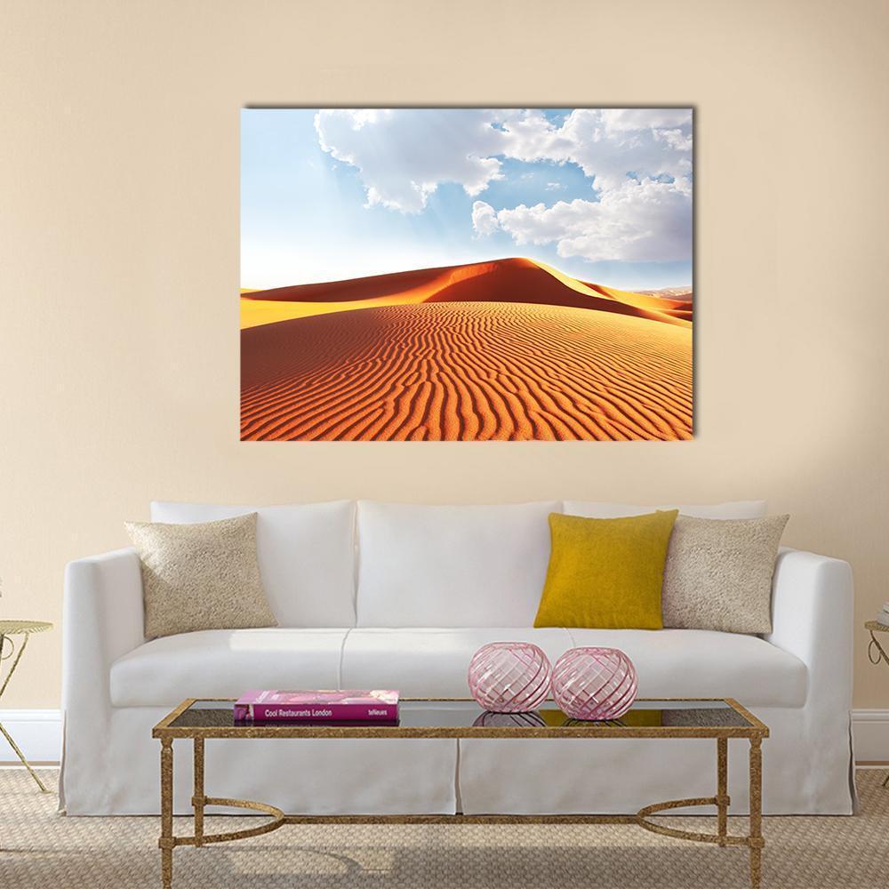 Sahara Sand Dunes Canvas Wall Art in orange, yellow and blue, single panel hung on a wall