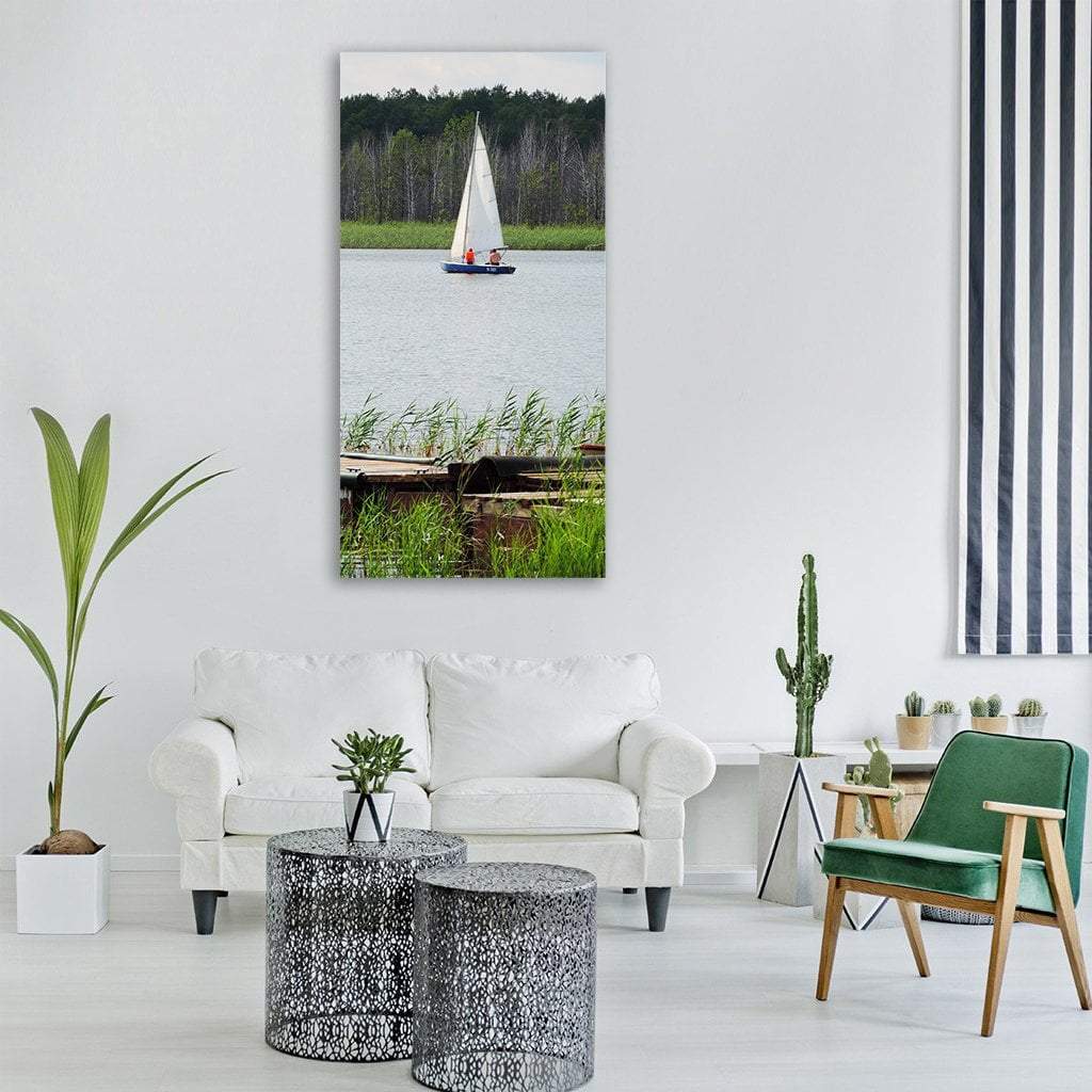 Sailboat on a Calm Summer Lake Vertical Canvas Wall Art in white, gray and green, single vertical panel hung on a wall