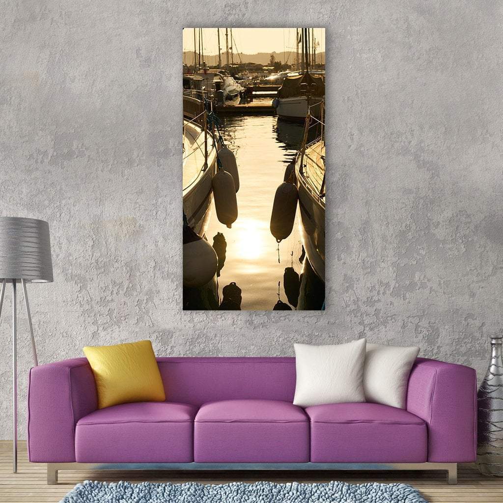 Sailboat in Marina at Sunset Vertical Canvas Wall Art in brown, gold and yellow, single vertical panel hung on a wall