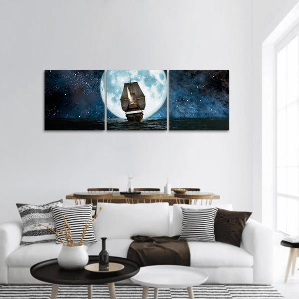 Sailing Ship Under a Full Moon Panoramic Canvas Wall Art in black, white and blue, hung on a wall