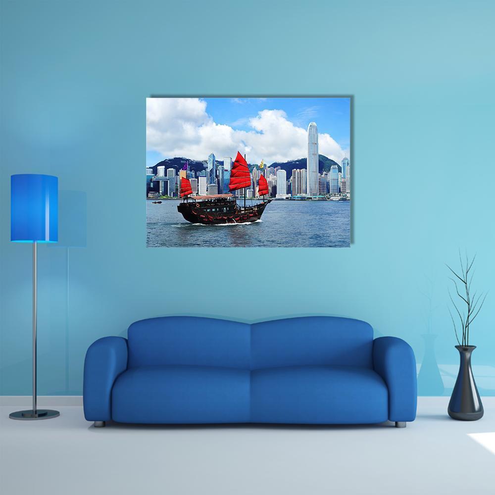 Traditional Junk Boat in Victoria Harbour Canvas Wall Art in white, red and blue, single panel hung on a wall