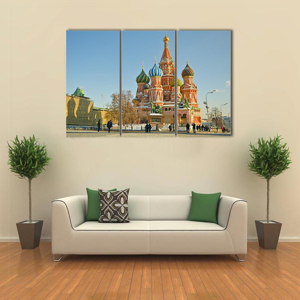 Saint Basil's Cathedral in Red Square Canvas Wall Art in beige, red and blue, 3 panel horizontal set hung on a wall