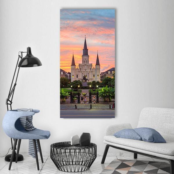 St. Louis Cathedral New Orleans Sunset Vertical Canvas Wall Art in orange, blue and pink, single vertical panel hung on a wall