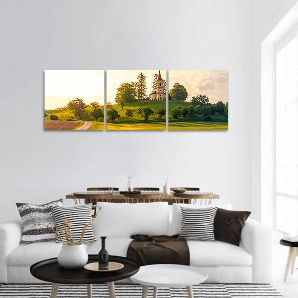 Saint Peter and Pauls Church in Czech Countryside Panoramic Canvas Wall Art in white, yellow and green, hung on a wall