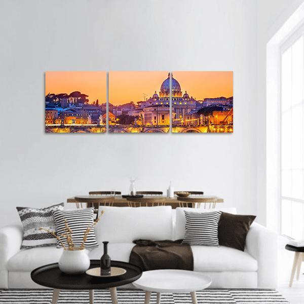 St. Peter's Basilica at Twilight Panoramic Canvas Wall Art in orange, yellow and blue, hung on a wall