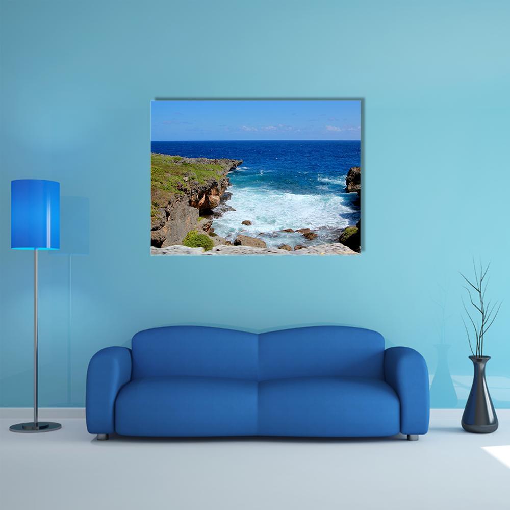 Saipan Cliffs with Crashing Waves Canvas Wall Art in white, green and blue, single panel hung on a wall