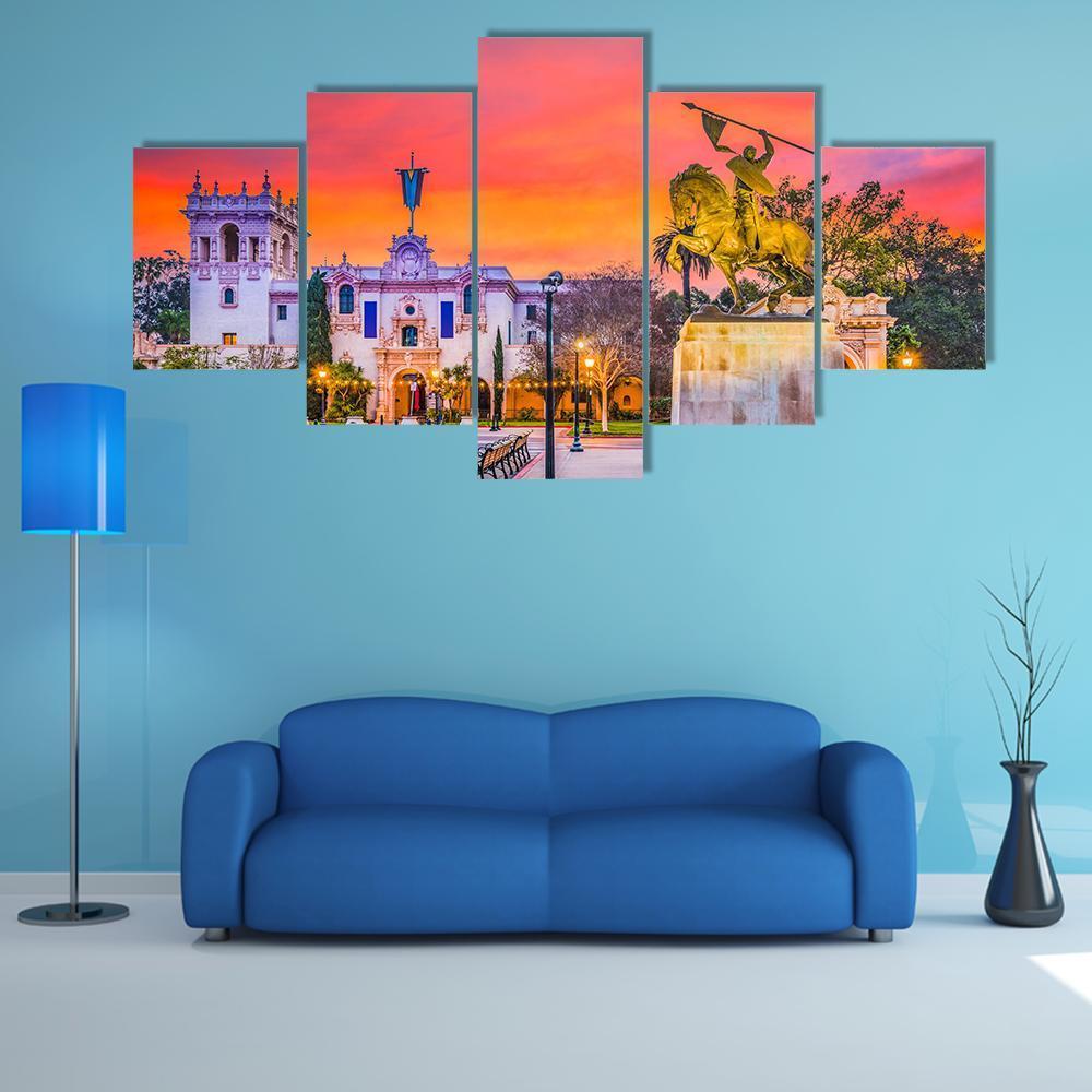 San Diego Cityscape with Equestrian Statue Canvas Wall Art in orange, purple and pink, 5 panel Star layout hung on a wall