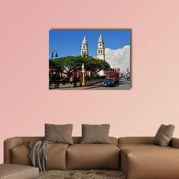 San Francisco De Campeche Cathedral Plaza Canvas Wall Art in beige, green and blue, single panel hung on a wall