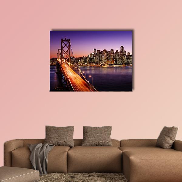 San Francisco Skyline and Bay Bridge at Sunset Canvas Wall Art in black, orange and purple, single panel hung on a wall