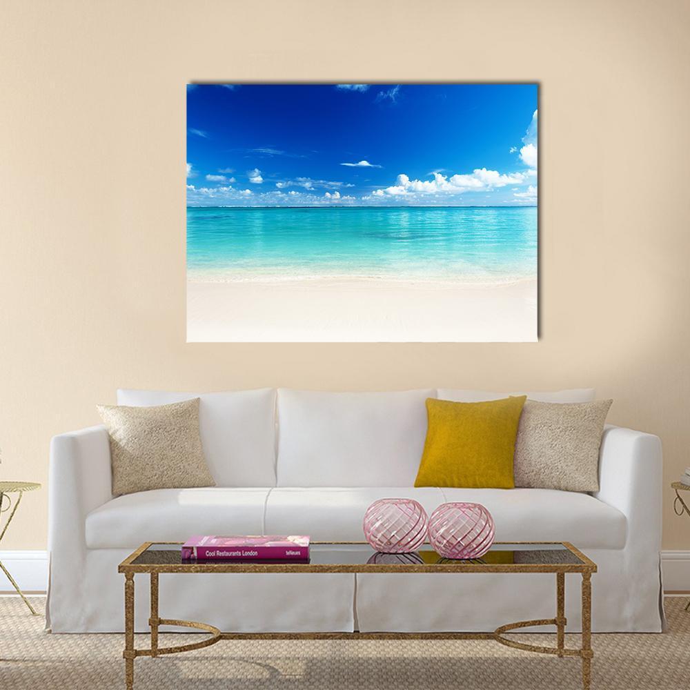 Caribbean Beach and Turquoise Sea Canvas Wall Art in white, beige and blue, single panel hung on a wall