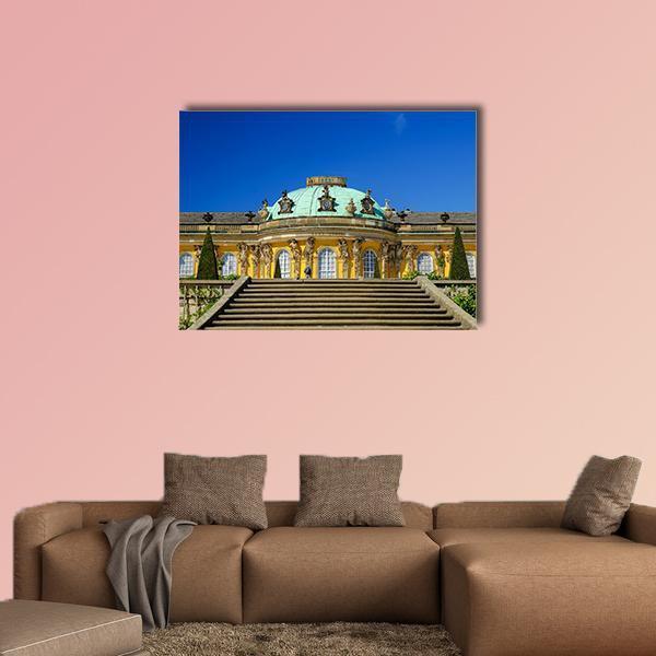 Sans-souci Palace Facade Canvas Wall Art in gray, yellow and blue, single panel hung on a wall