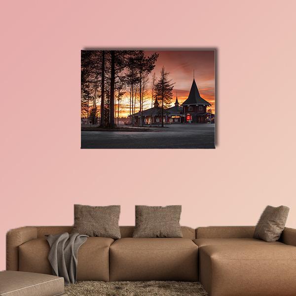Santa Claus Village in Finland Canvas Wall Art in black, brown and orange, single panel hung on a wall