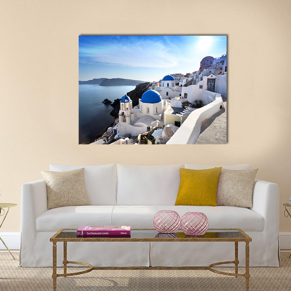 Santorini Island with Blue Domed Churches Canvas Wall Art in white and blue, single panel hung on a wall