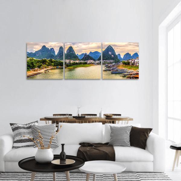 Guilin River and Karst Peaks at Golden Hour Panoramic Canvas Wall Art in gold, yellow and green, hung on a wall