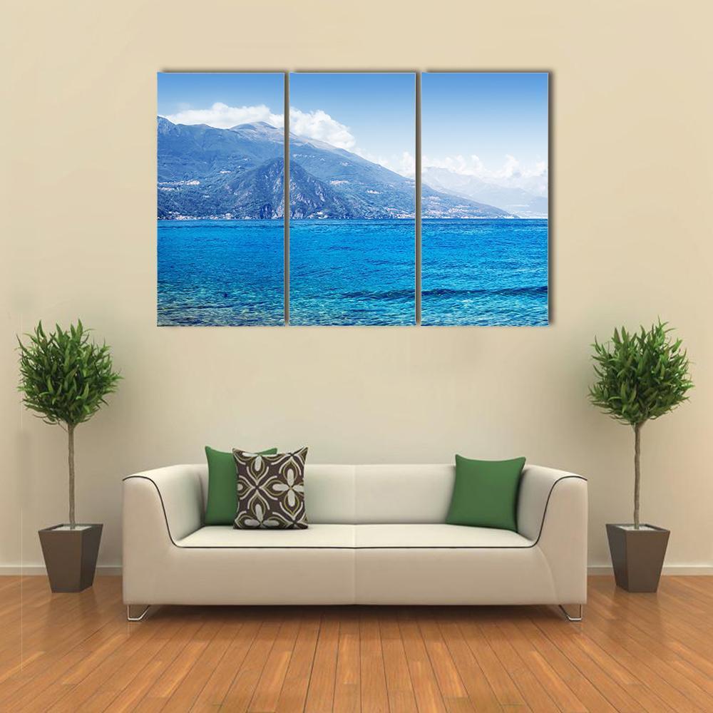 Lake Como Landscape Canvas Wall Art in white and blue, 3 panel horizontal set hung on a wall