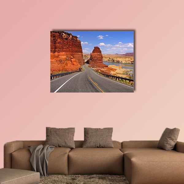 Scenic Desert Drive Canvas Wall Art in gray, orange and blue, single panel hung on a wall